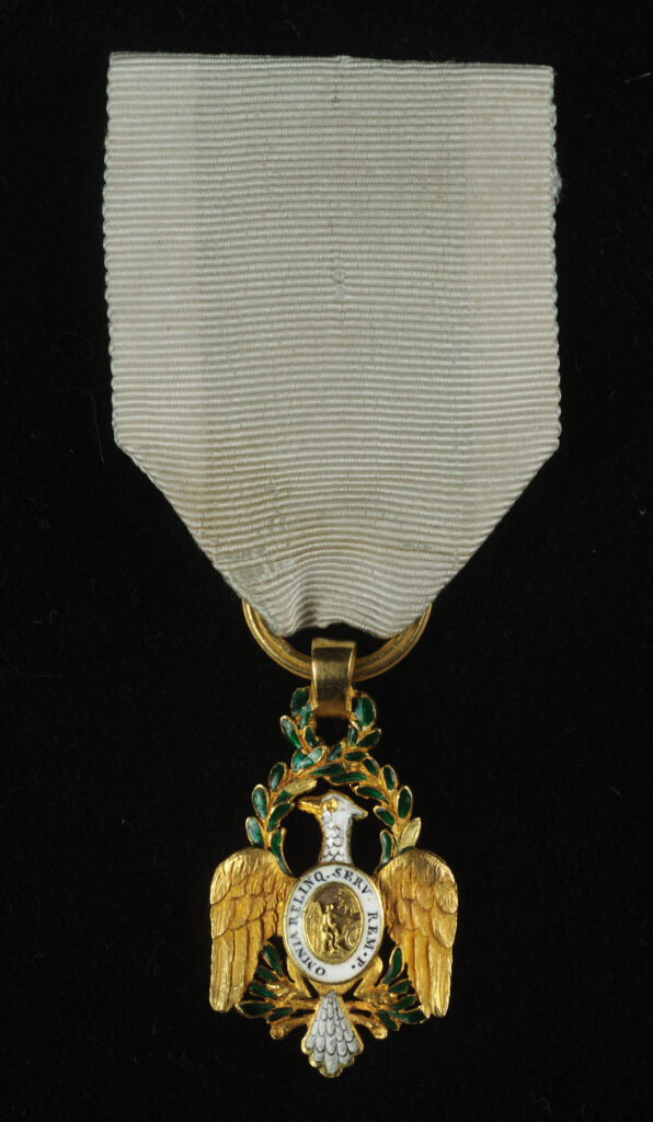 Click for a larger view. Gold insignia of the Society of the Cincinnati on a short faded blue ribbon