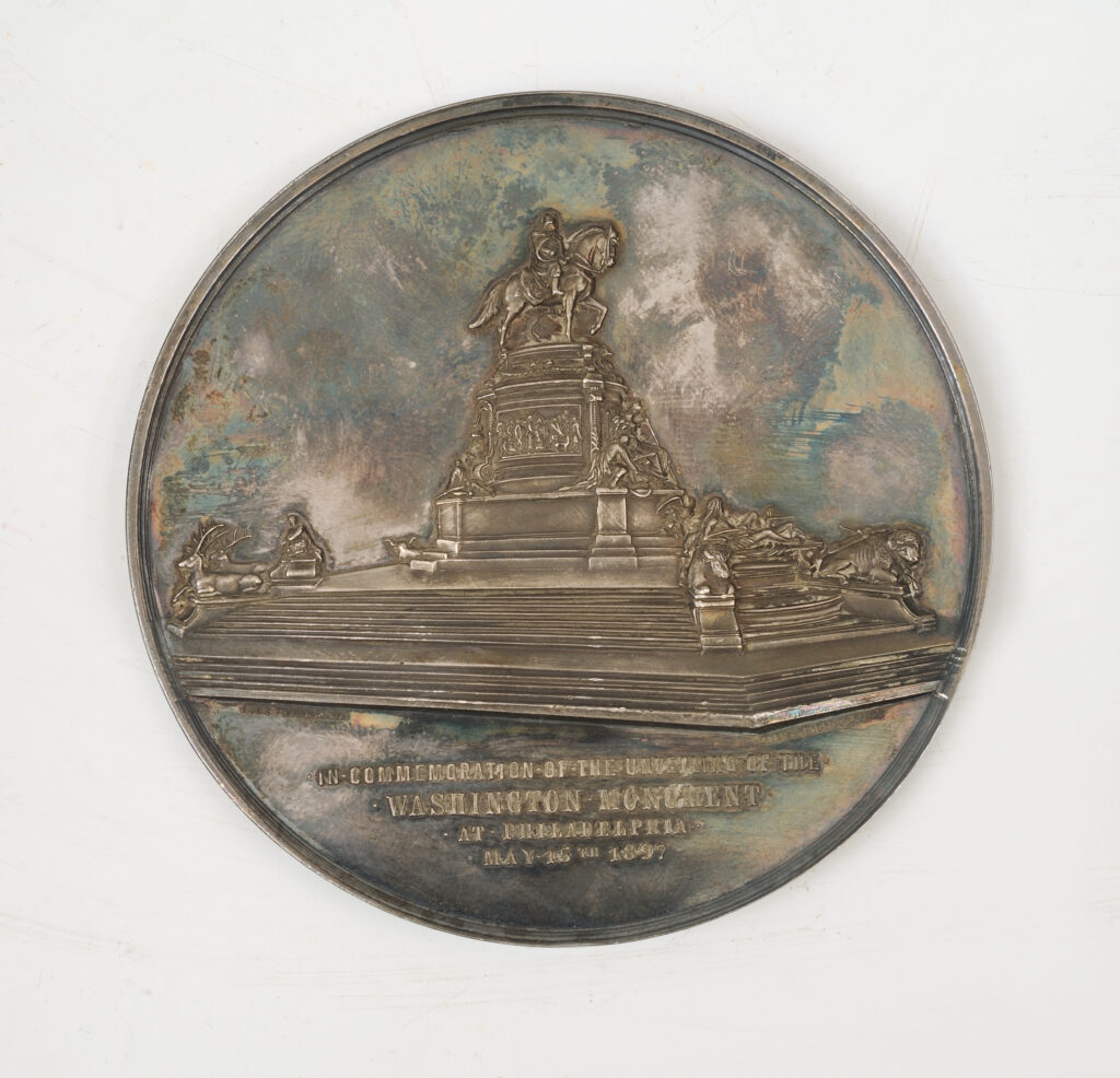 Click for a larger view. Circular silver medal depicting an equestrian statue of George Washington