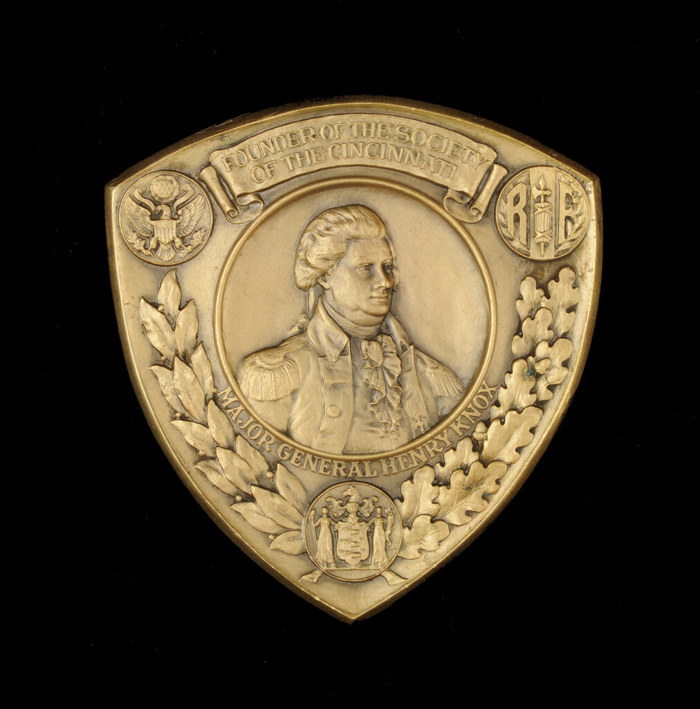 Click for a larger view. Shield-shaped bronze medal with a portrait of Henry Knox commemorating the 1926 Triennial Meeting of the Society of the Cincinnati